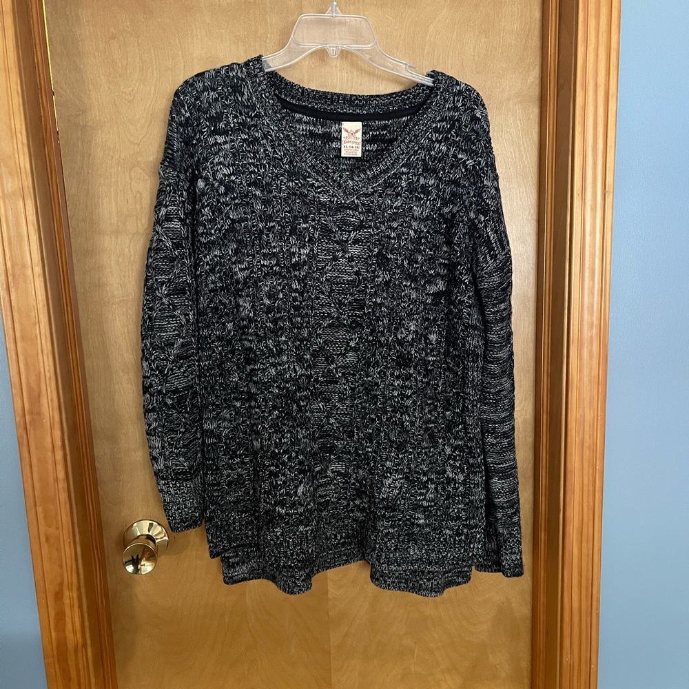 Ladies black sweater.